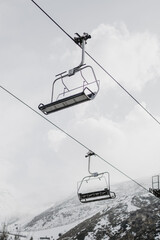 Closeup of a Ski Lift with a cloudy sky background