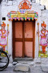 Obraz na płótnie Canvas 21 March 2022, Pandharpur, India, Old Vintage wooden door on retro wall, Pandharpur, India.