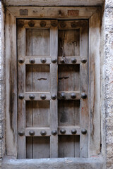 21 March 2022, Pandharpur, India, Old Vintage wooden door on retro wall, Pandharpur, India.