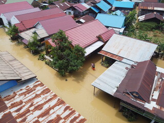 Aerial view of Situation Flood in sangatta city, east kutai, east Kalimantan, Indonesia in 21 March 2022. Floods hit homes and highways, disrupting transportation,  floods because high rainfall.