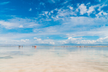 Reflections of the clouds in the clear water of the sea