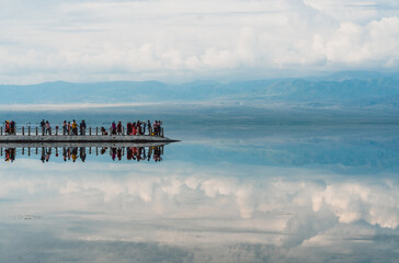 Reflections of the clouds in the clear water of the sea
