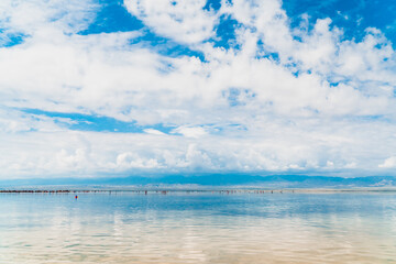 Reflections of the clouds in the clear water of the sea
