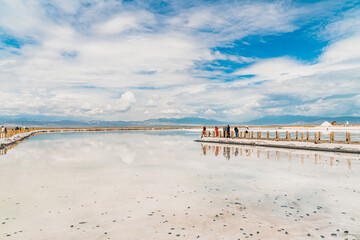 Reflections of the clouds in the clear water of the sea