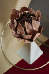 Closeup of a flower brooch made of leather