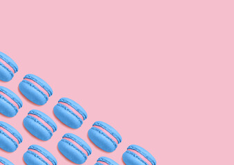 Almond cookies. Top view photo with copy space. Bright blue macaroons on pink background. Minimal style