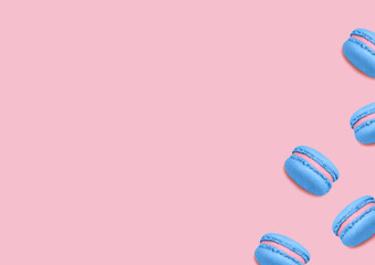 Almond cookies. Top view photo. Blue colored macarons on pink background. Minimal style