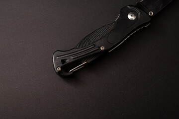 Black hunting knife on the background
