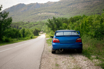 blue car on the road, travel vacation roadtrip journey