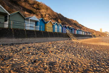 Charming beach huts by the sandy beach in Cromer, north Norfolk, UK. Photographed in January 2022.