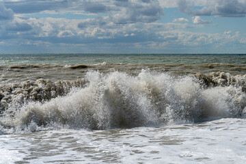 sea waves splashing on a hot summer  beach
