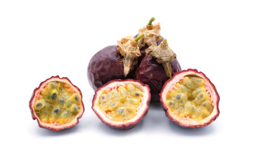 Three slice passion fruit with leaves on white background.