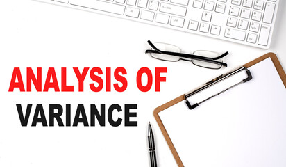 ANALYSIS OF VARIANCE text written on white background with keyboard, paper sheet and pen