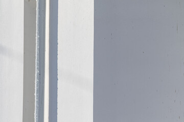 Background of a white wall with a corner.