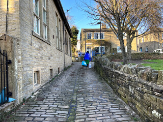 View up, Havelock Square, with Victorian stone cobbles, and cottages, on a late winters day in, Thornton, Bradford, UK