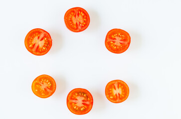 Cut tomatoes on white background