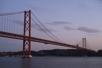 Fototapeta na wymiar Red 25 of April bridge. Lisbon, Portugal.
