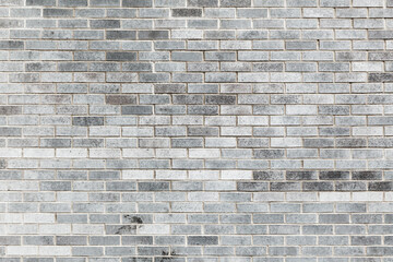 Gray brick wall, frontal background texture