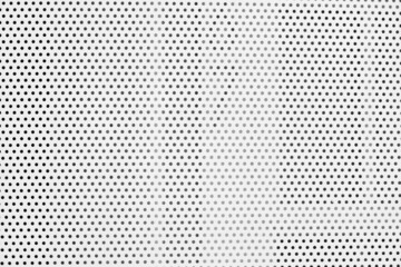 Partial white grated steel door.