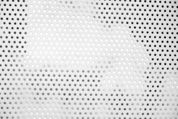 Partial white grated steel door.