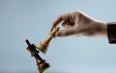 Player defeating his opponent and winning at chess game