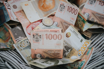 Closeup shot of the 50, 1000 and 2000 Serbian Dinara banknotes and coins