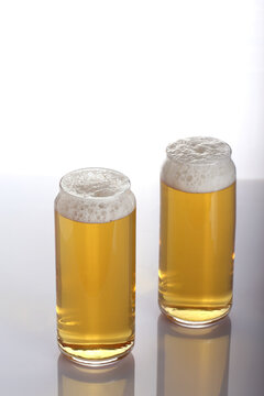 beer in a glass glass stands on a white background