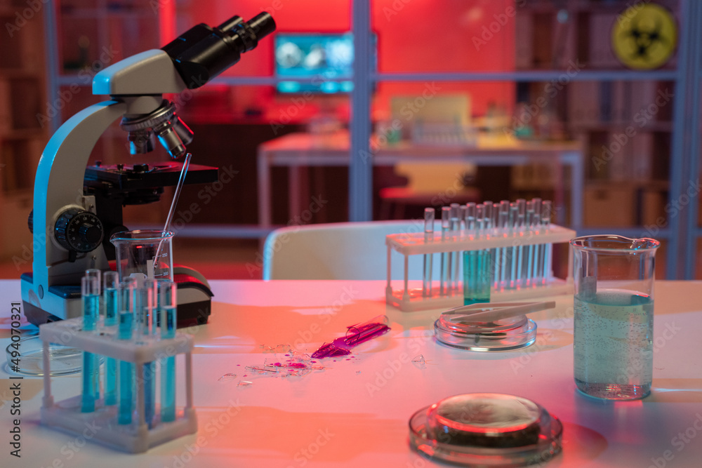 Poster broken flask containing liquid dangerous pathogen on workplace of modern scientist or virologist in 