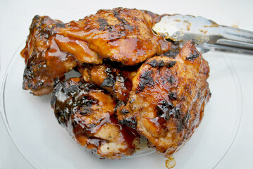 Serving Picnic BBQ Chicken with Tongs