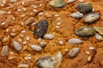 Close up of healthy eating with oatmeal cookies or oatmeal cakes. The concept of vegetarian food. Fresh oatmeal cookies fall sesame
