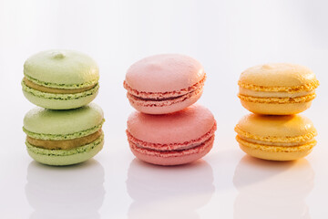 Sweet colorful macarons isolated on white background. Tasty colourful macaroons