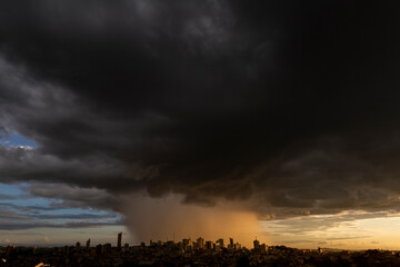 Varginha, Minas Gerais, Brazil: February 22, 2022: Torrential rain over downtown Varginha with heavy clouds at sunset