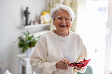 Portrait of smiling senior woman at home
