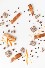 Flat lay of candy and caramel on isolated white background