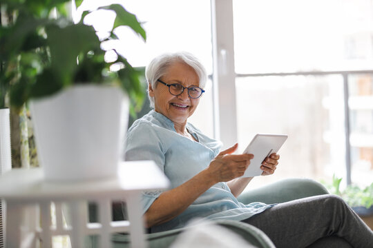Senior Woman Using A Digital Tablet At Home
