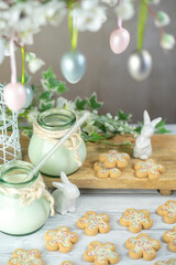 Easter flower biscuits and milk with Easter holiday decoration.