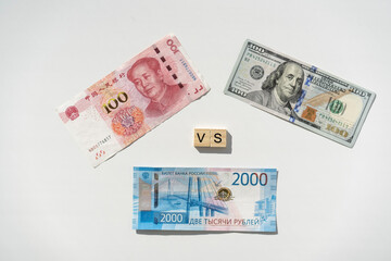 Ruble, Dollar and Yuan banknotes. Confrontation of three currencies