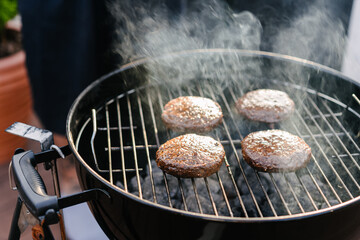 Raw vegan cutlets cooked on the grill outdoors. Plant Based Meat Replacement