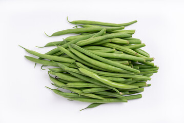 A heap of fine green beans or french beans on a white background. View from above.