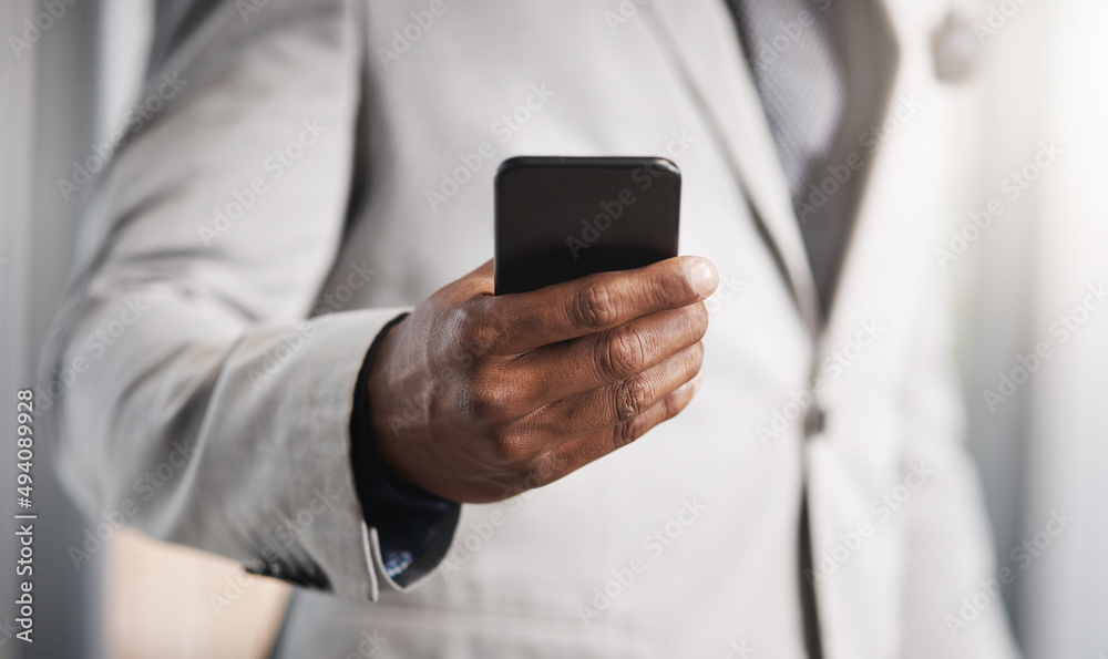 Fototapete running business with instant connectivity. closeup shot of an unrecognizable businessman using a ce