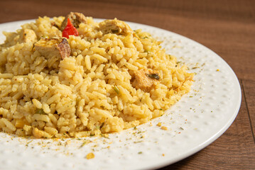 Vegan food, vegan risotto on a white plate, over wood, selective focus.