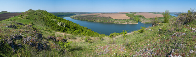 Amazing spring view on the Dnister River Canyon with picturesque rocks, fields, flowers. This place named Shyshkovi Gorby,  Nahoriany, Chernivtsi region, Ukraine.