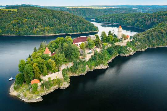 Panoramic view of Zvikov Castle on the hill with trees surrounded by river Vltava and Otava in South Bohemia region in Czech Republic. Pine or spruce forest on the background 