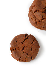 Fresh homemade chocolate cookies on a white background.