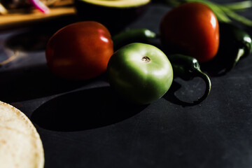  tomato Food ingredients on table on dark concept in Mexico Latin America