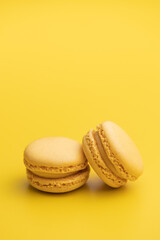 Sweet yellow macarons. Traditional french macaroons. Tasty dessert