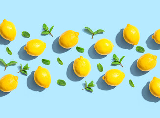 Fresh yellow lemons with mints overhead view - flat lay