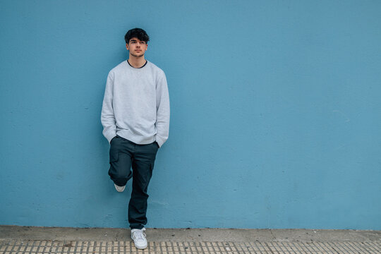 urban style teenager on the wall with copy space