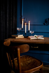 vintage composition on the table. Candle books and photo frame
