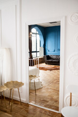 interior of a bright living room. White wall with stucco